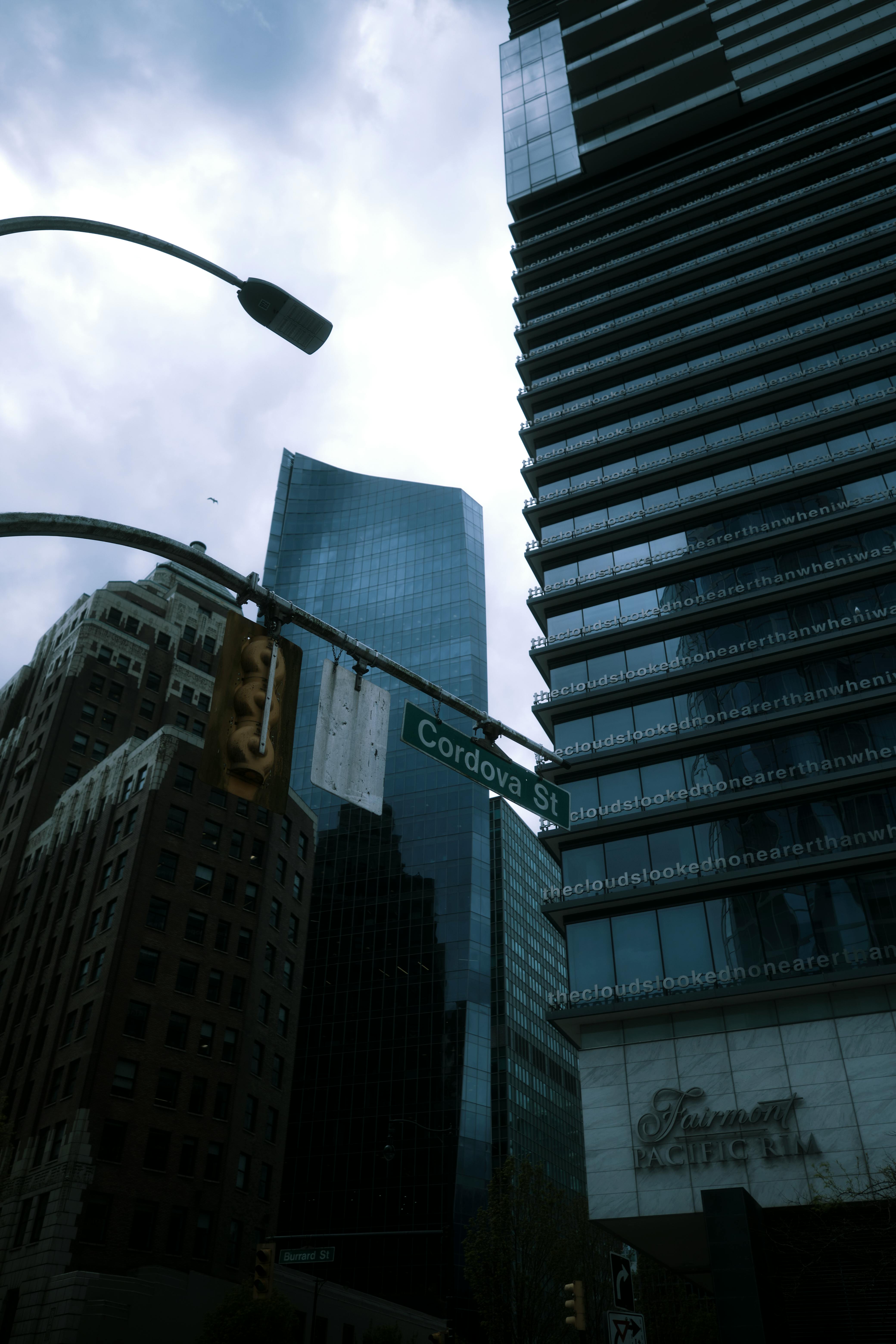 Street Signs and Traffic Light on the Street · Free Stock Photo