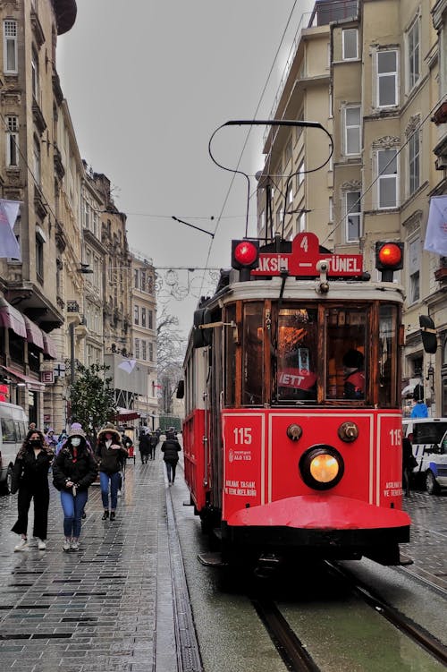 Red Vintage Tram on a Downtown Street