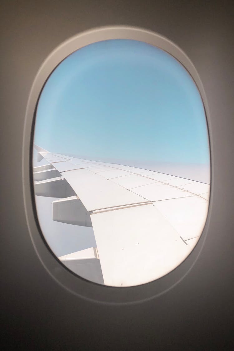 Window Showing Airplane Wing