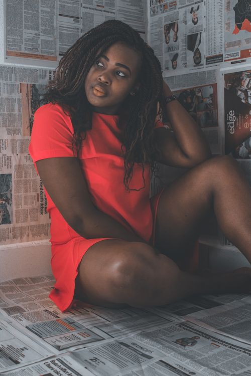 A Woman in Red Dress Sitting on the Floor · Free Stock Photo