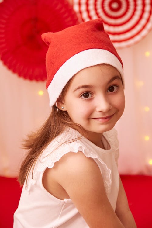 A Portrait of a Little Girl in a Red Hat