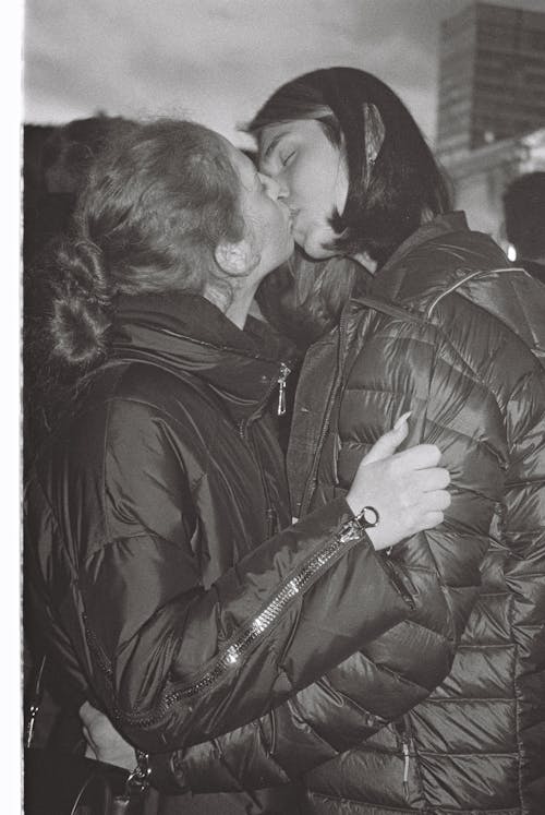 Black and White Photo of a Kissing Couple