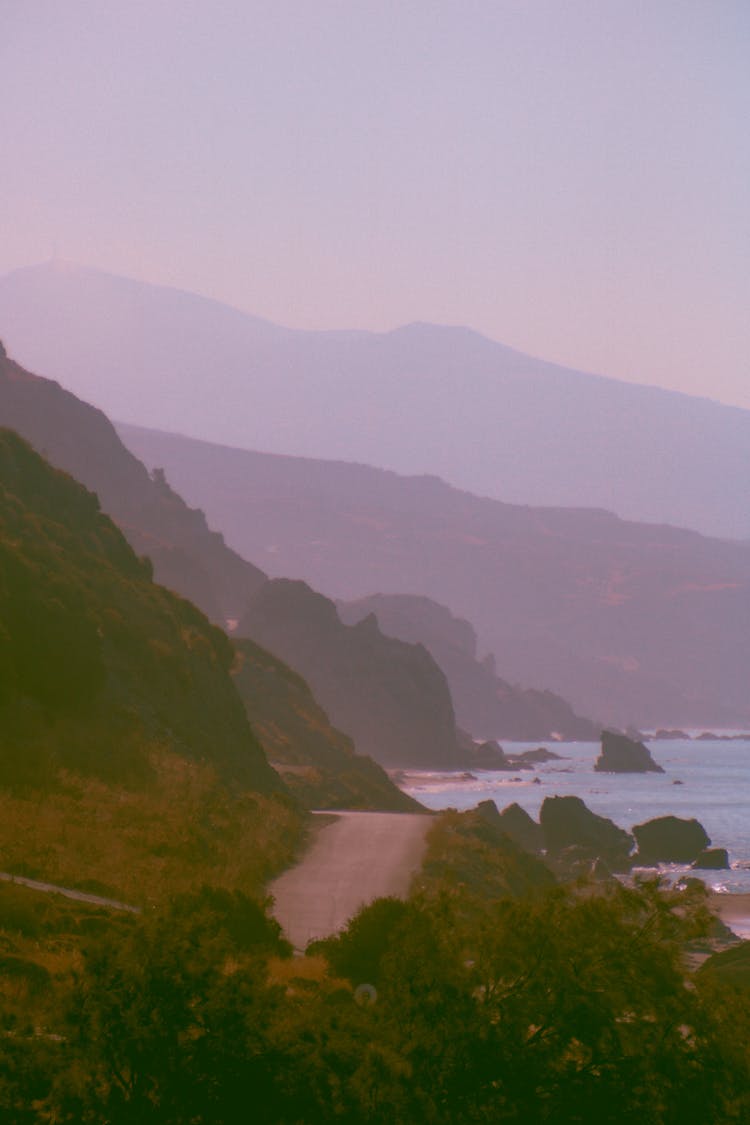 Silhouettes Of Mountains In Fog