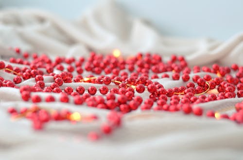 Close-up of Christmas Ornament in a Shape of Red Pearls 