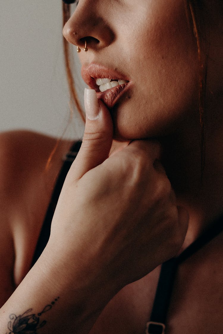 Beautiful Woman With A Thumb In Her Mouth 