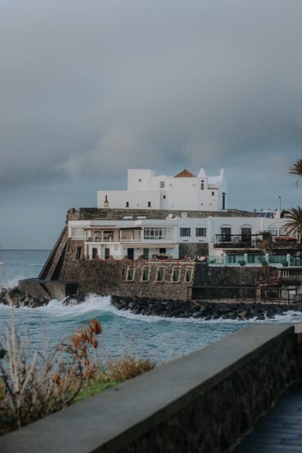 Captivating coastal architecture in Italy with a dramatic seascape backdrop.