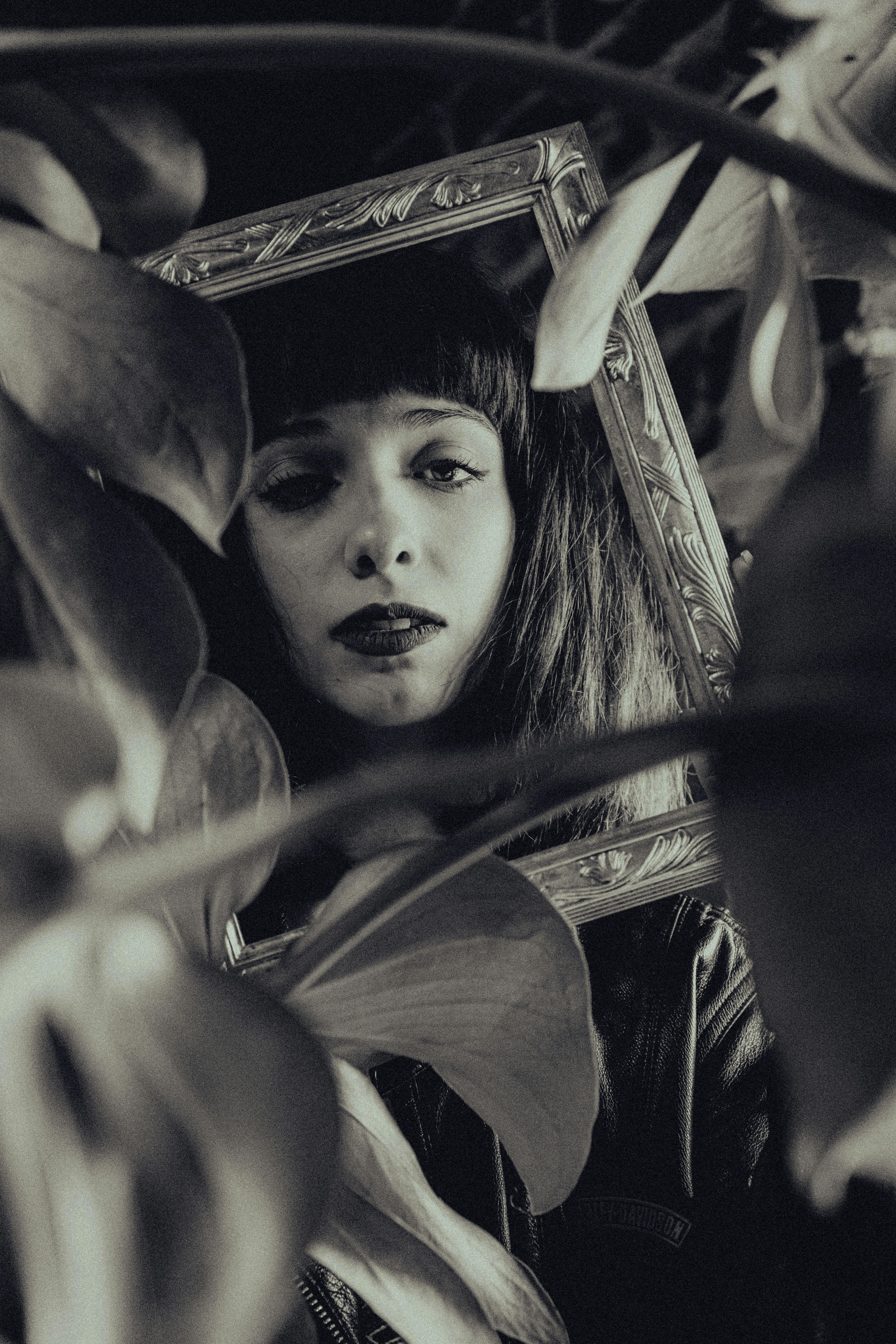 a woman with long hair and a black and white photo