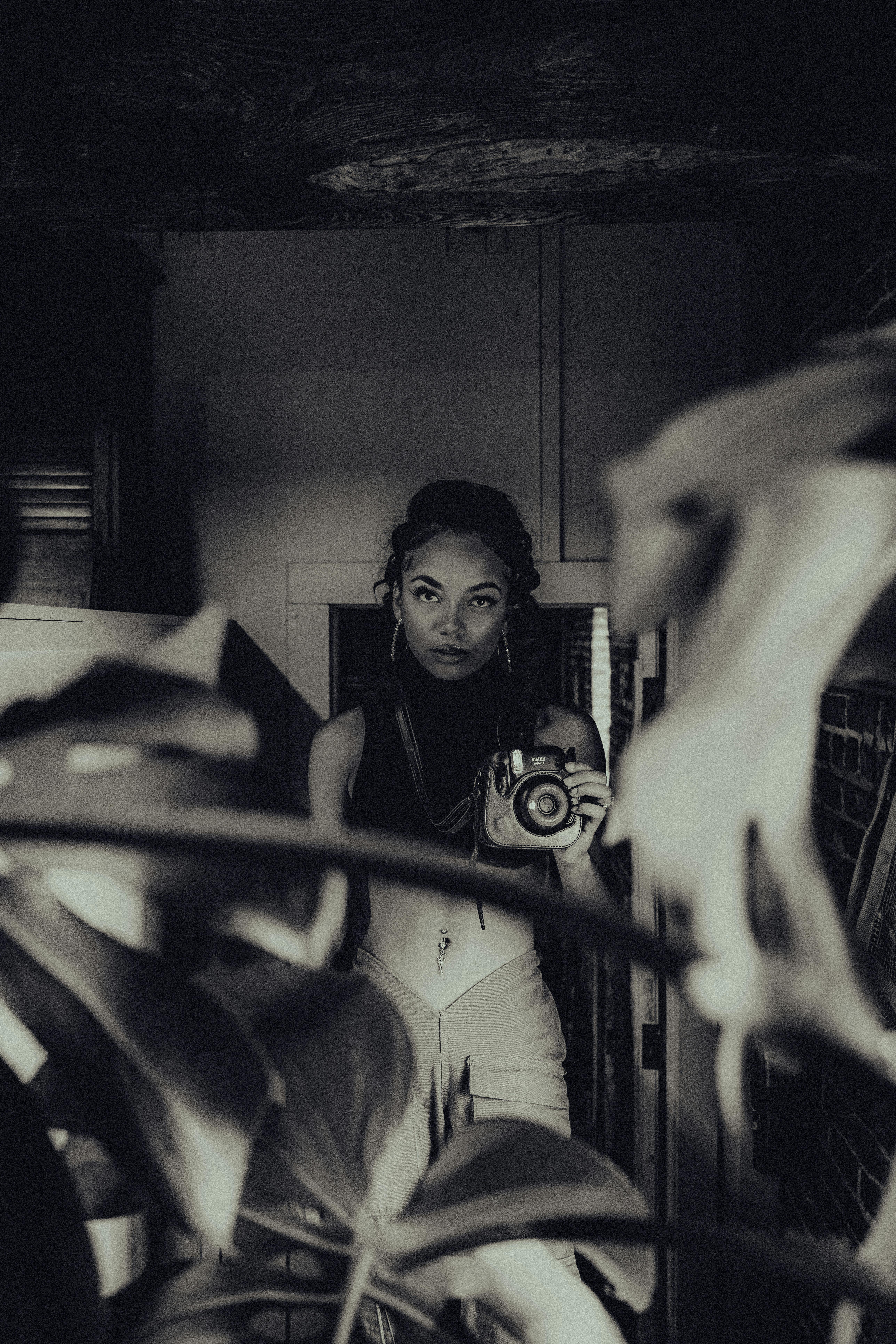 a woman taking a selfie in a mirror