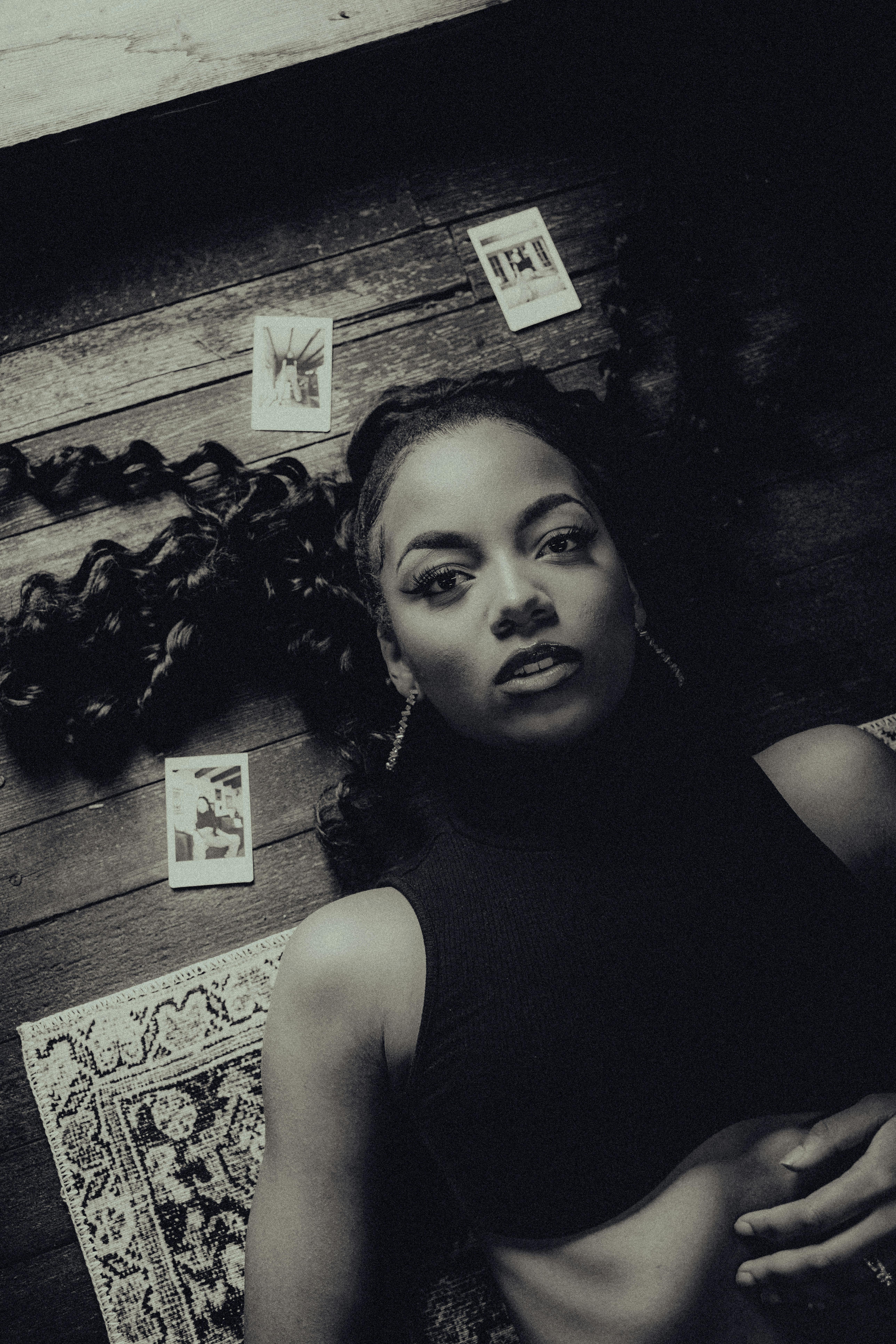 a woman laying on the floor with cards