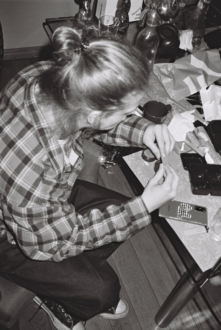 Woman Sitting At Table