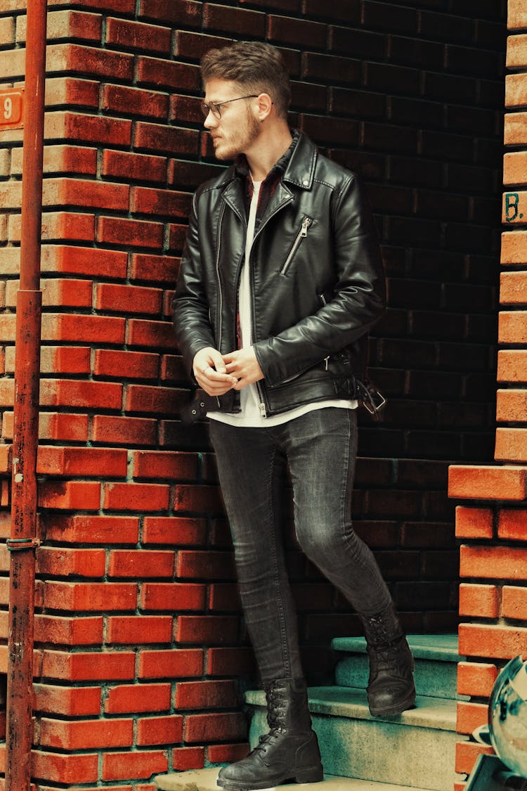 Young Man Standing On Steps