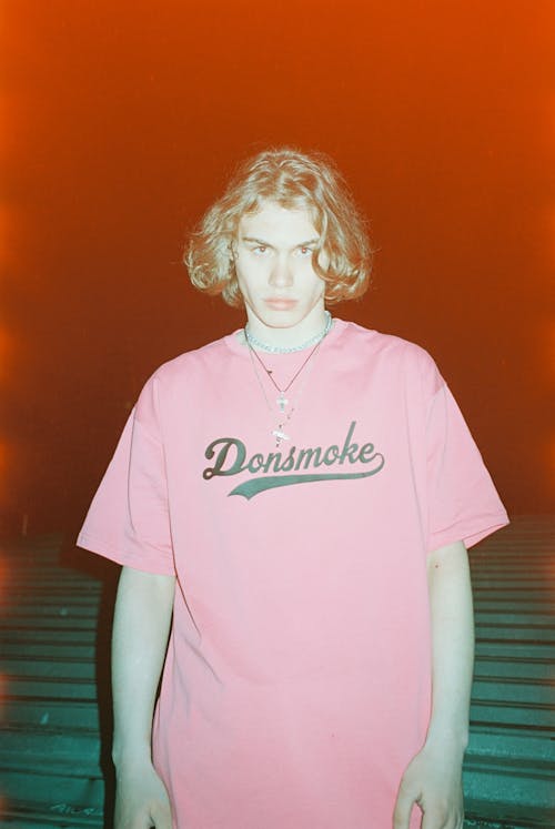 Teenage Boy in a Pink T-Shirt 