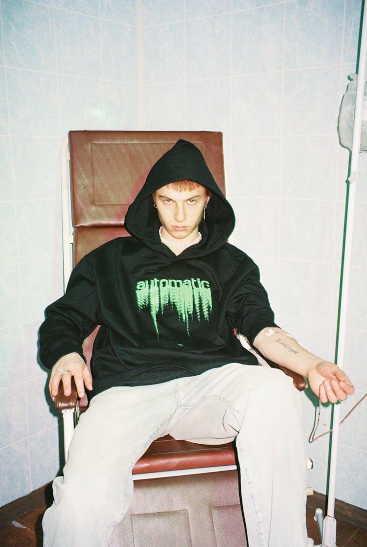 Young Man In Hoodie With IV Drip