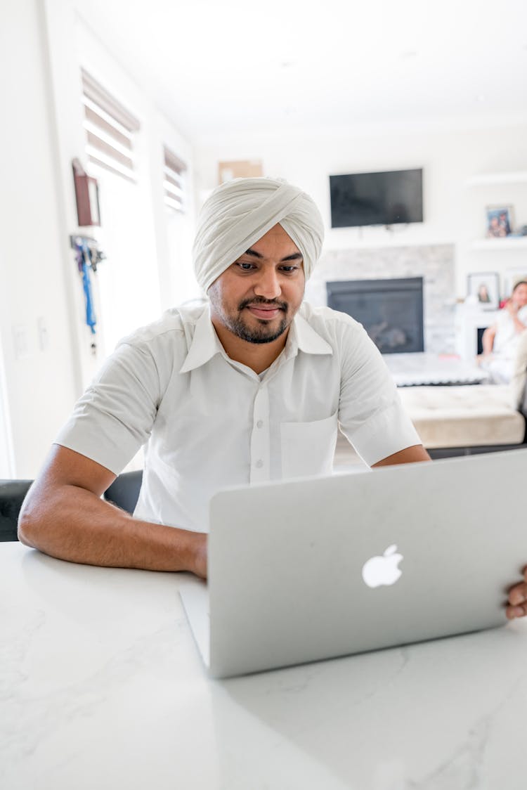 Man Sitting With Laptop