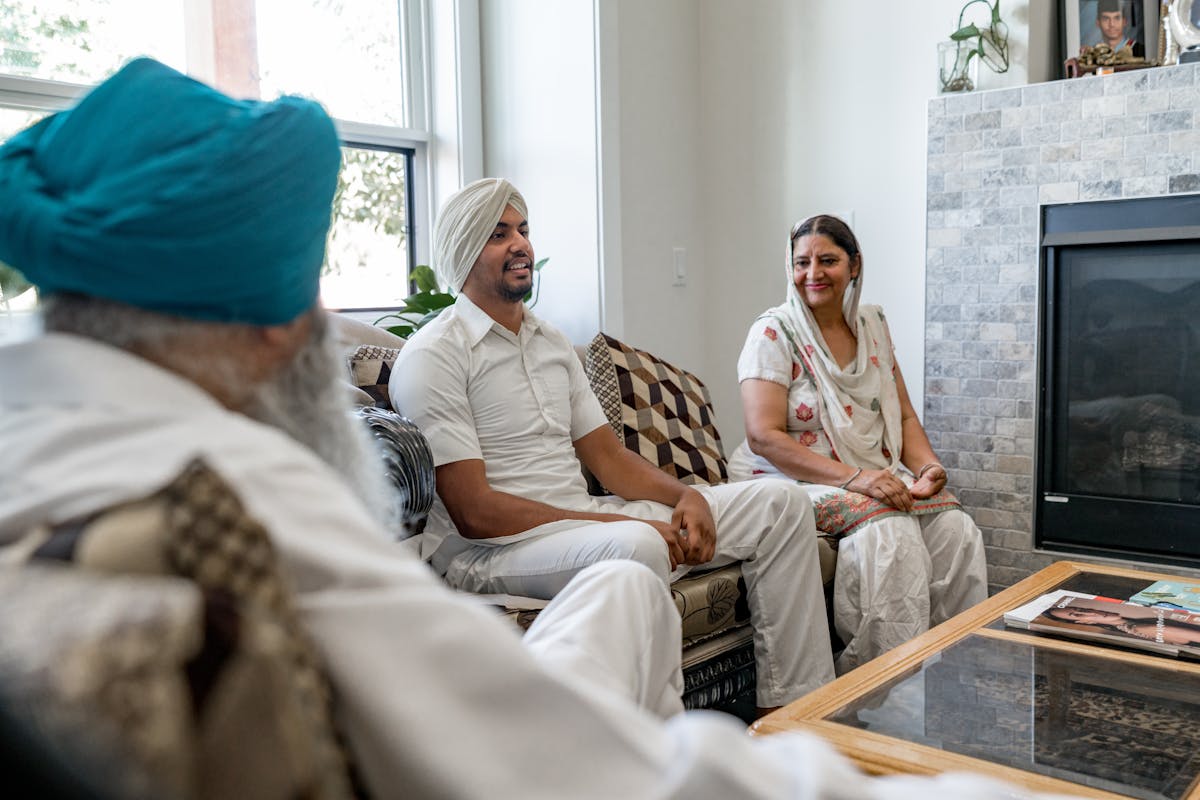 Family talking calmly in a bright living room