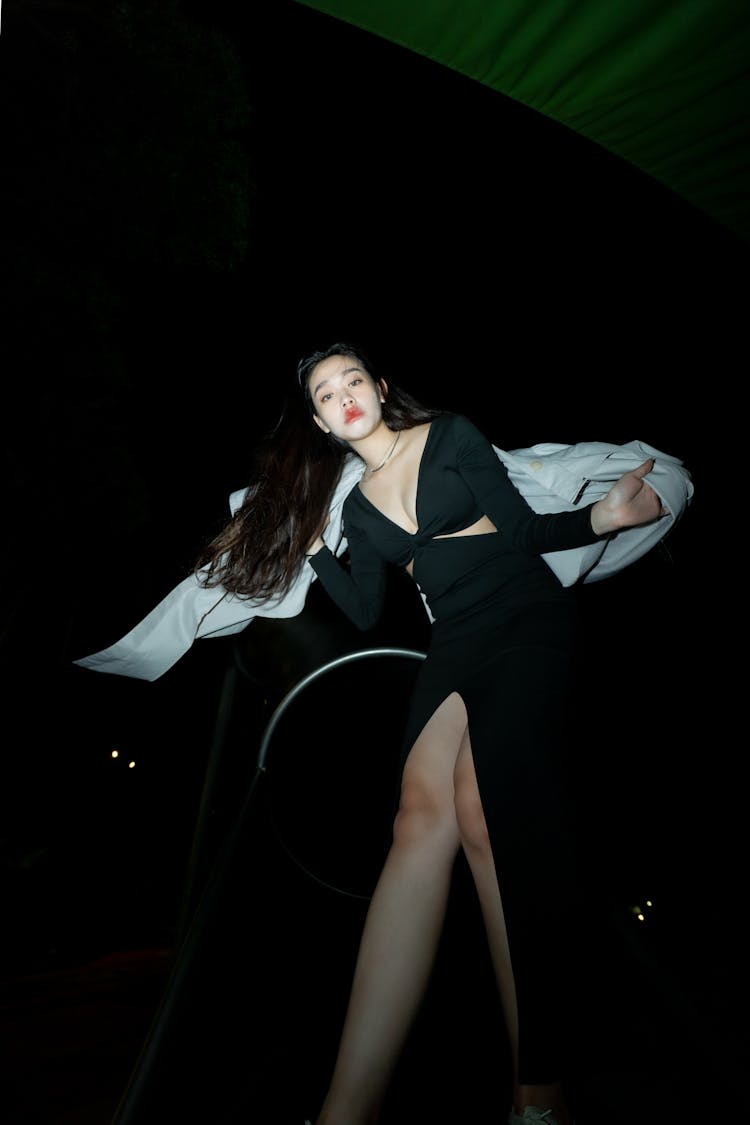 Low Angle Shot Of A Young Woman In A Dress