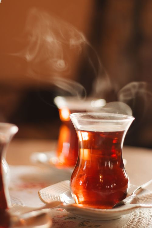 Free A close-up of steaming Turkish tea served in a traditional glass cup reflecting cultural warmth. Stock Photo
