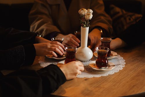 People Hands around Turkish Tea