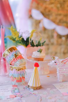 Vibrant birthday party decorations with party hats and festive decor.