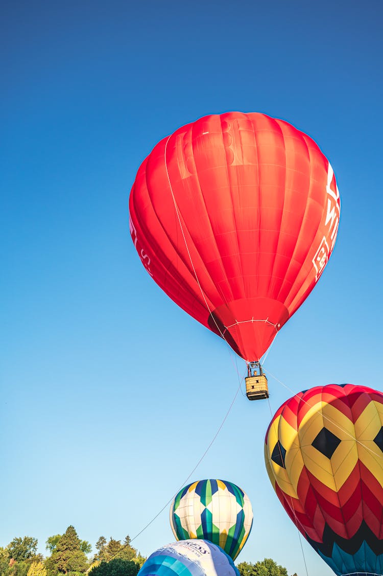 Red Hot Air Balloon Under Blue Sky 