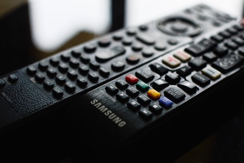 Detailed close-up of a Samsung remote control showcasing buttons and logo.