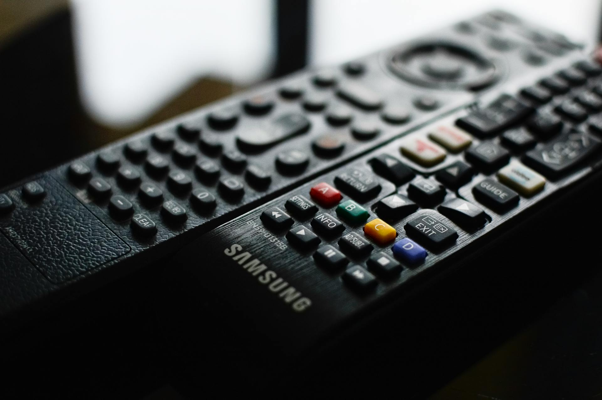 Detailed close-up of a Samsung remote control showcasing buttons and logo.