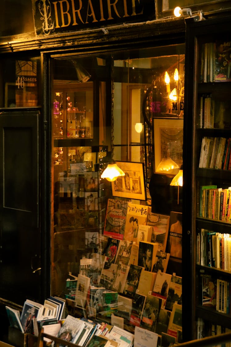 A Bookstore With Books And A Lamp On The Front