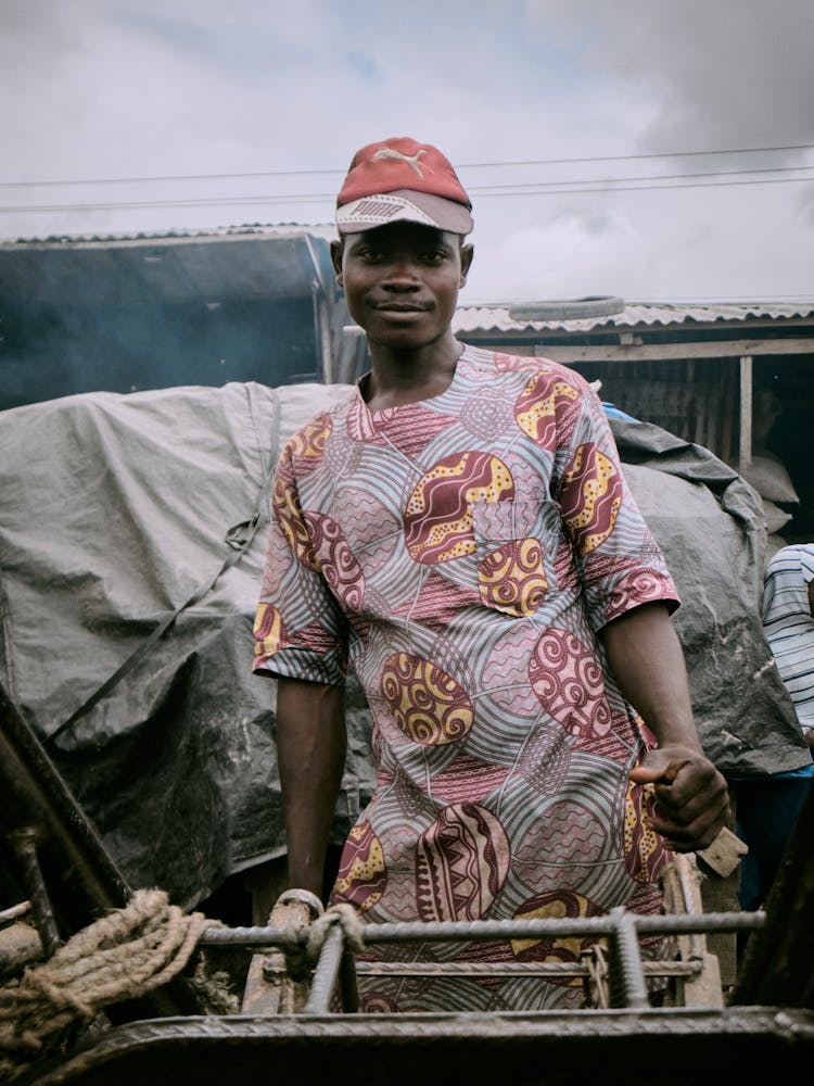 Man In Traditional Clothes Working Outdoors