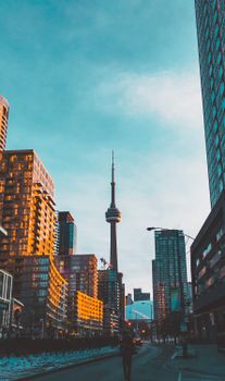A stunning view of Toronto's skyline featuring the CN Tower during sunset, showcasing urban architecture.