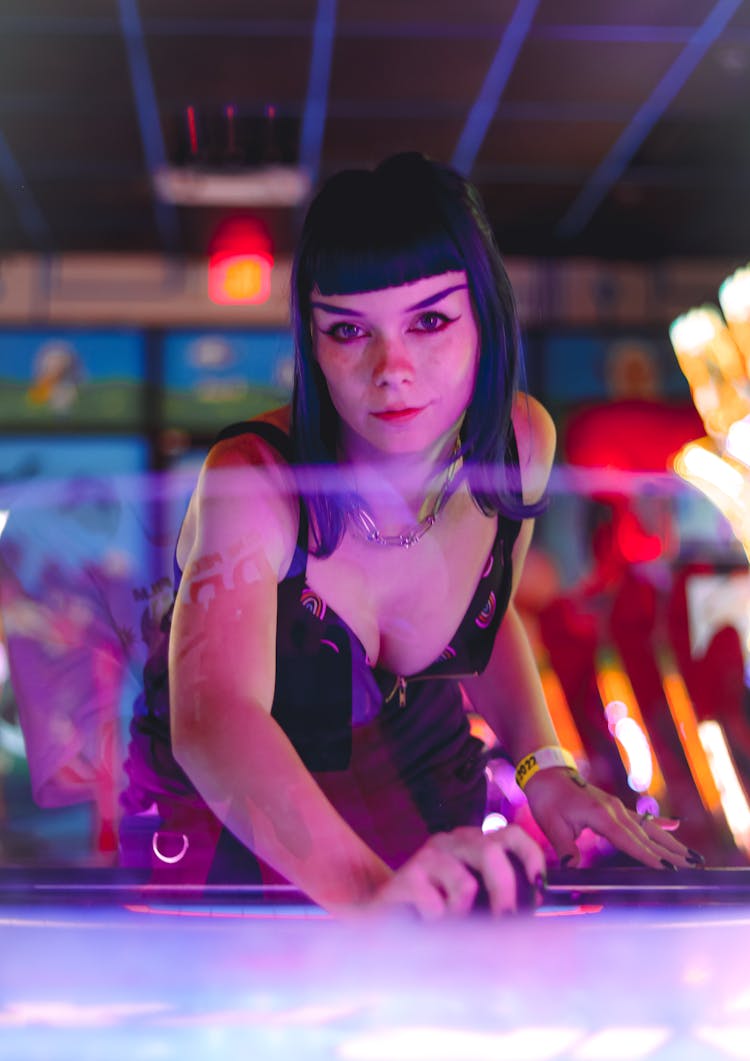 A Woman With Bangs Playing Air Hockey