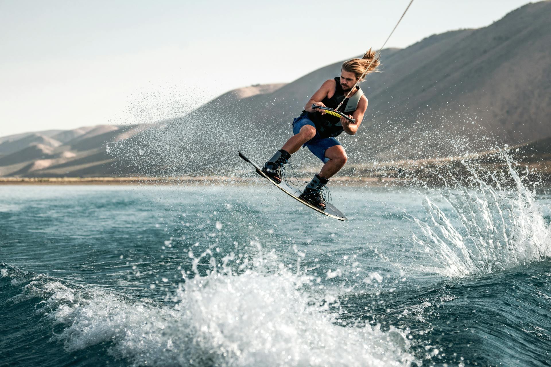 Man Wakeboarding on Ocean Waves