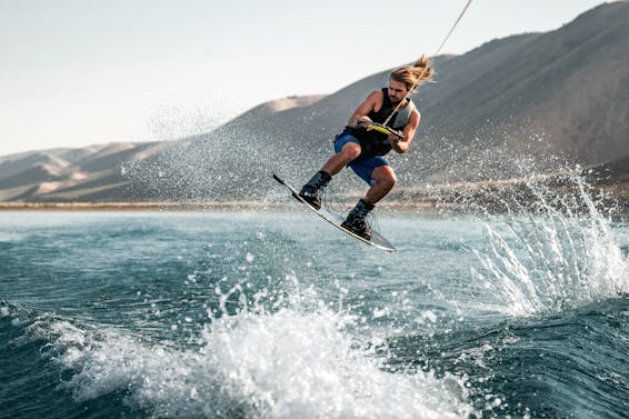 Man Wakeboarding on Ocean Waves