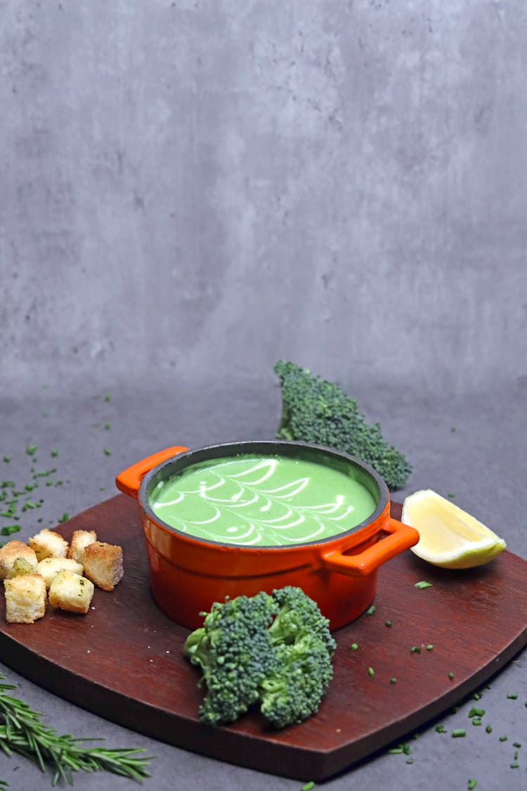 Cream Of Broccoli Soup In Orange Soup Pot 