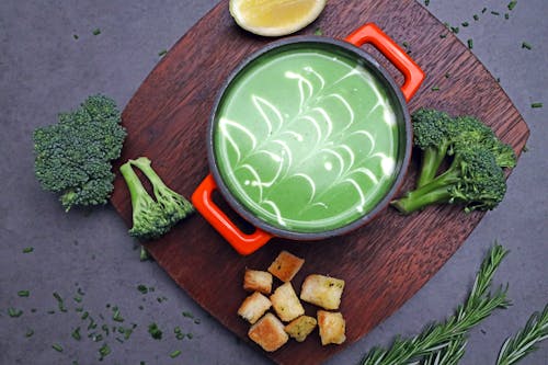 Green Soup on a Wooden Chopping Board