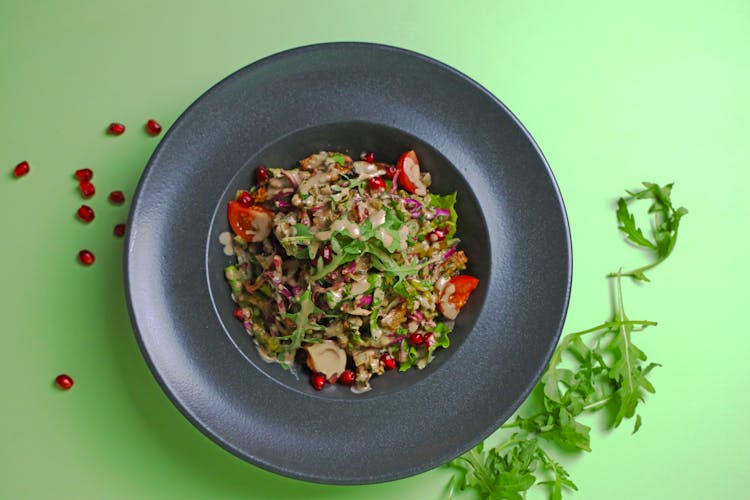 Fresh Salad With Pomegranate Seeds In A Bowl