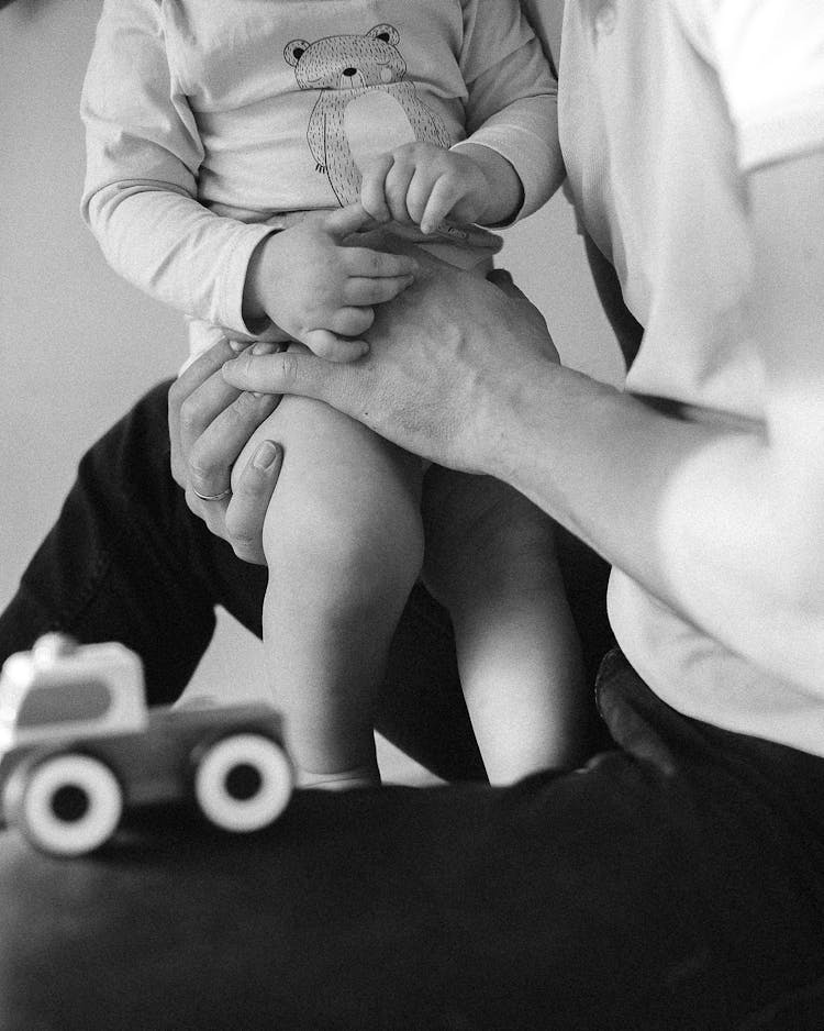 Father Holding His Little Baby 