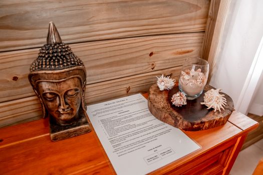 Document on a Side Table by a Tray and a Statue
