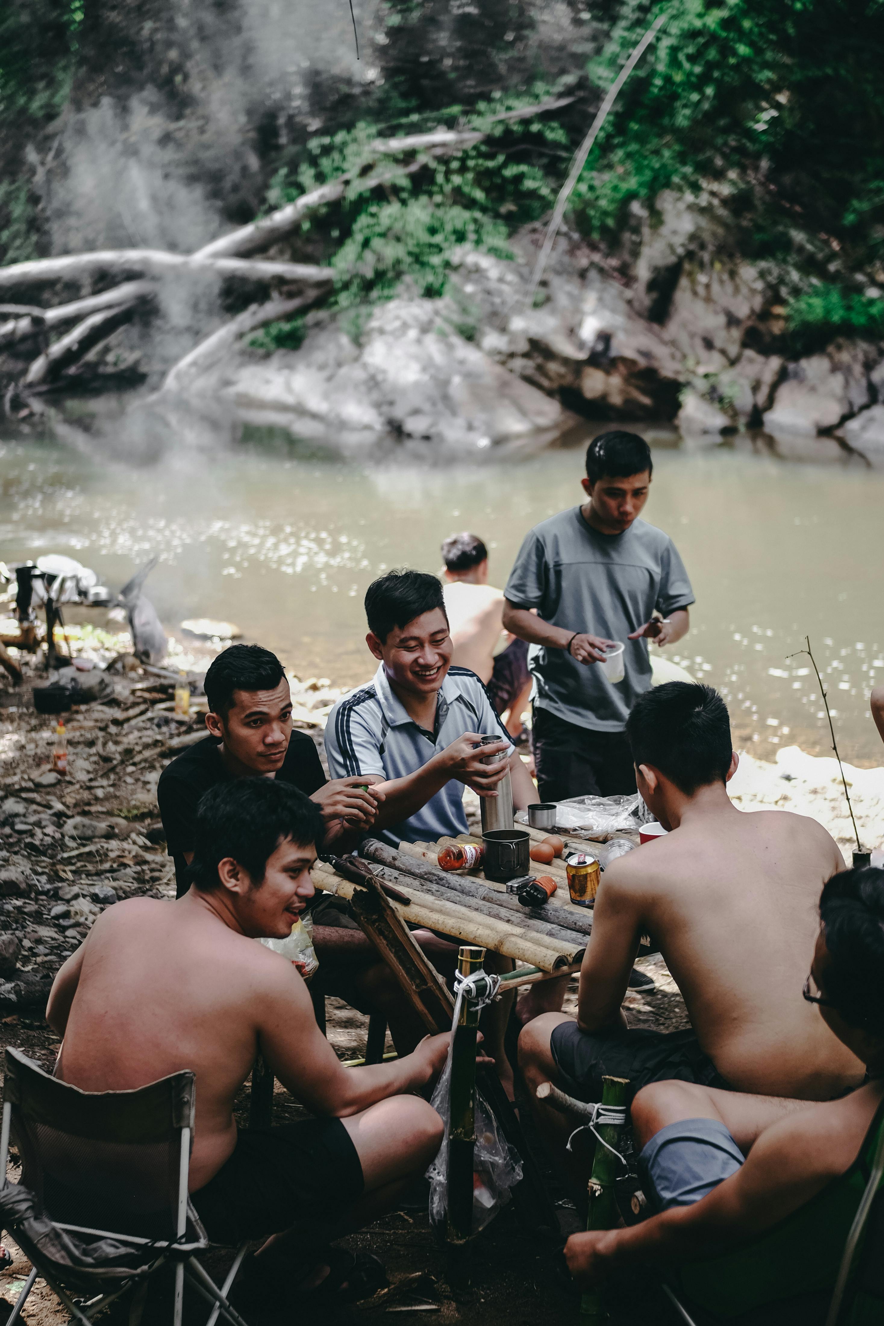 Group of Men Sitting on Brown Table · Free Stock Photo