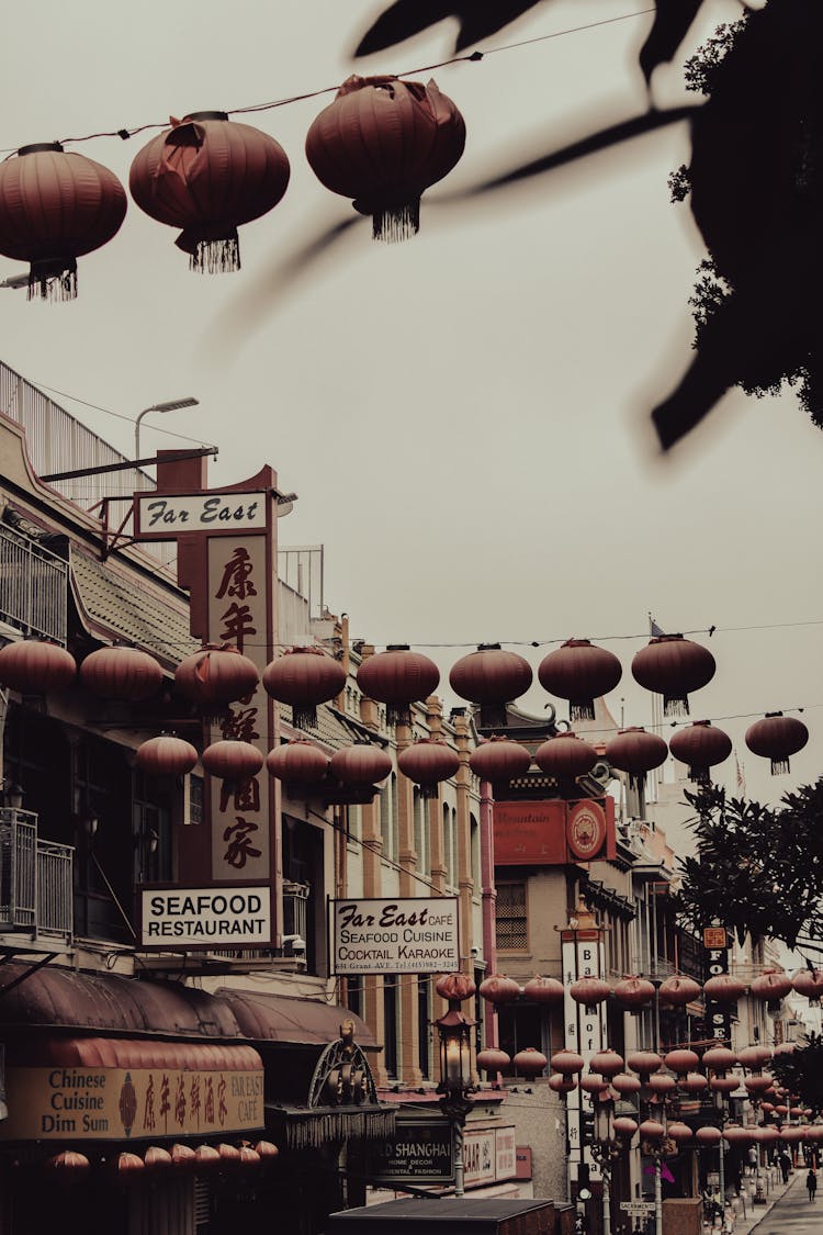 Damaged Chinese Lanterns Hanging On The Street