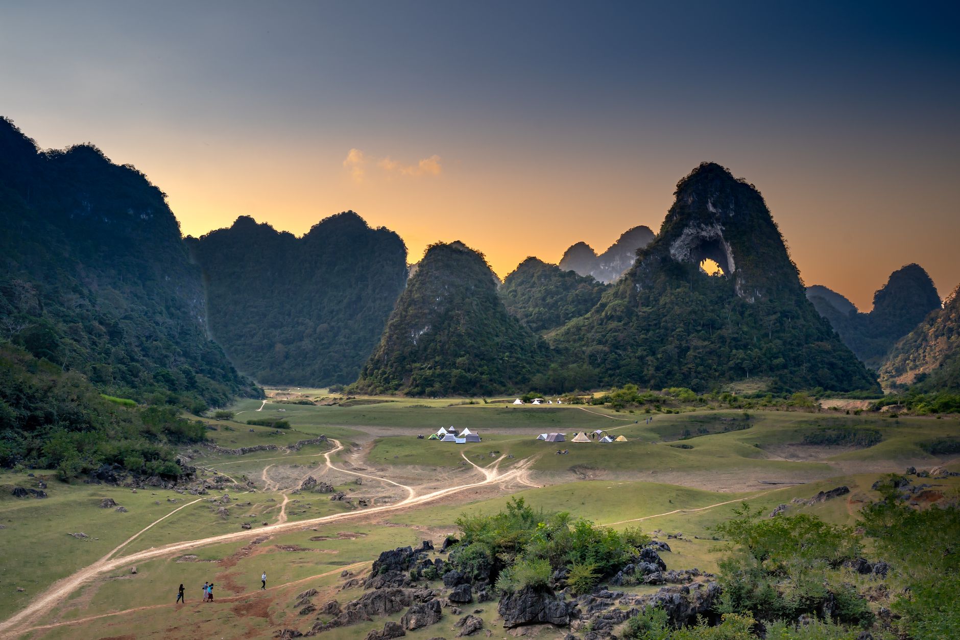 Scenic view of Cao Bang's limestone mountains and valley during sunset, Vietnam.