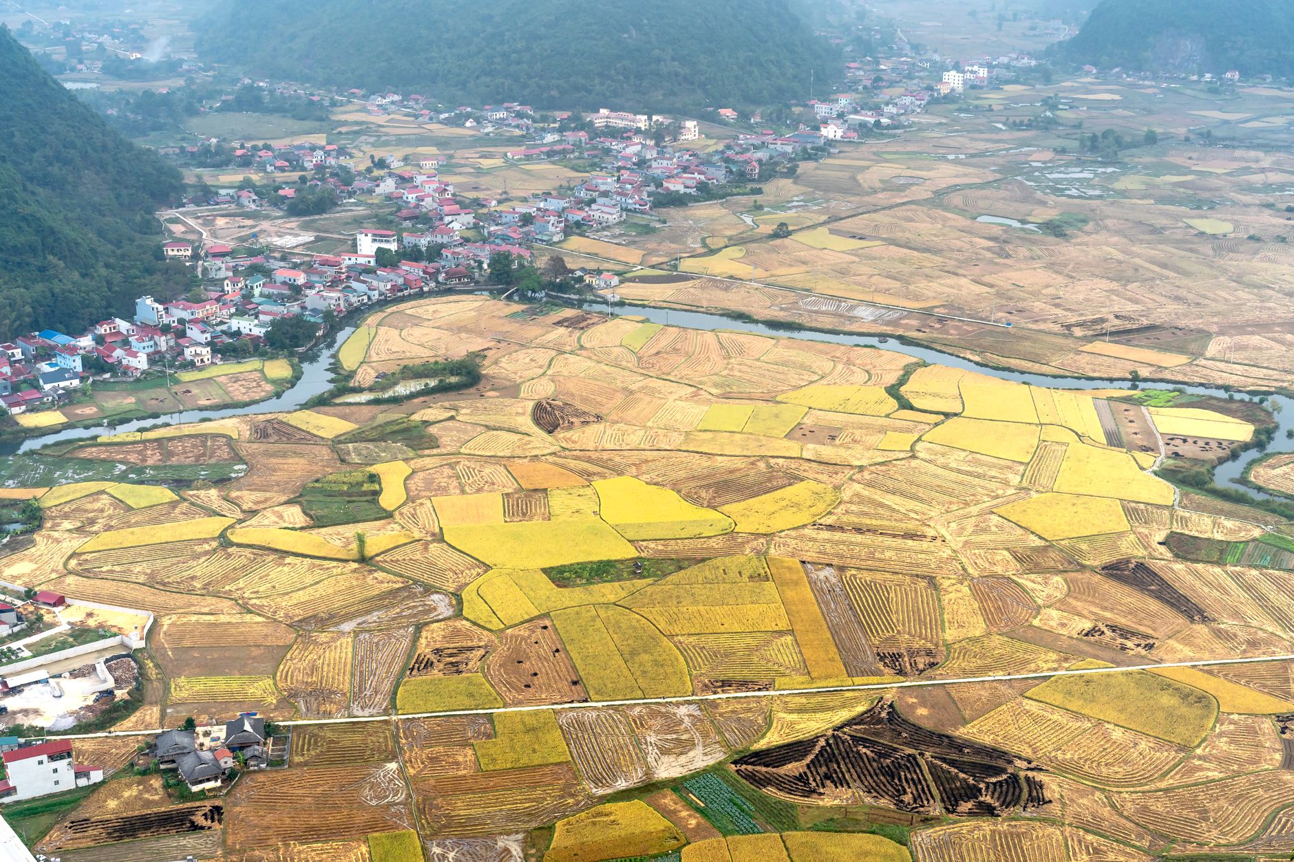 Stunning aerial view of Bac Son Valley's patchwork farmland in Vietnam.