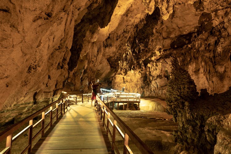 A Person Taking Pictures In A Cave