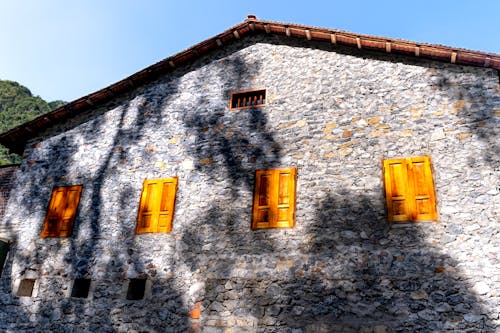 Stone House with Wooden Shutters