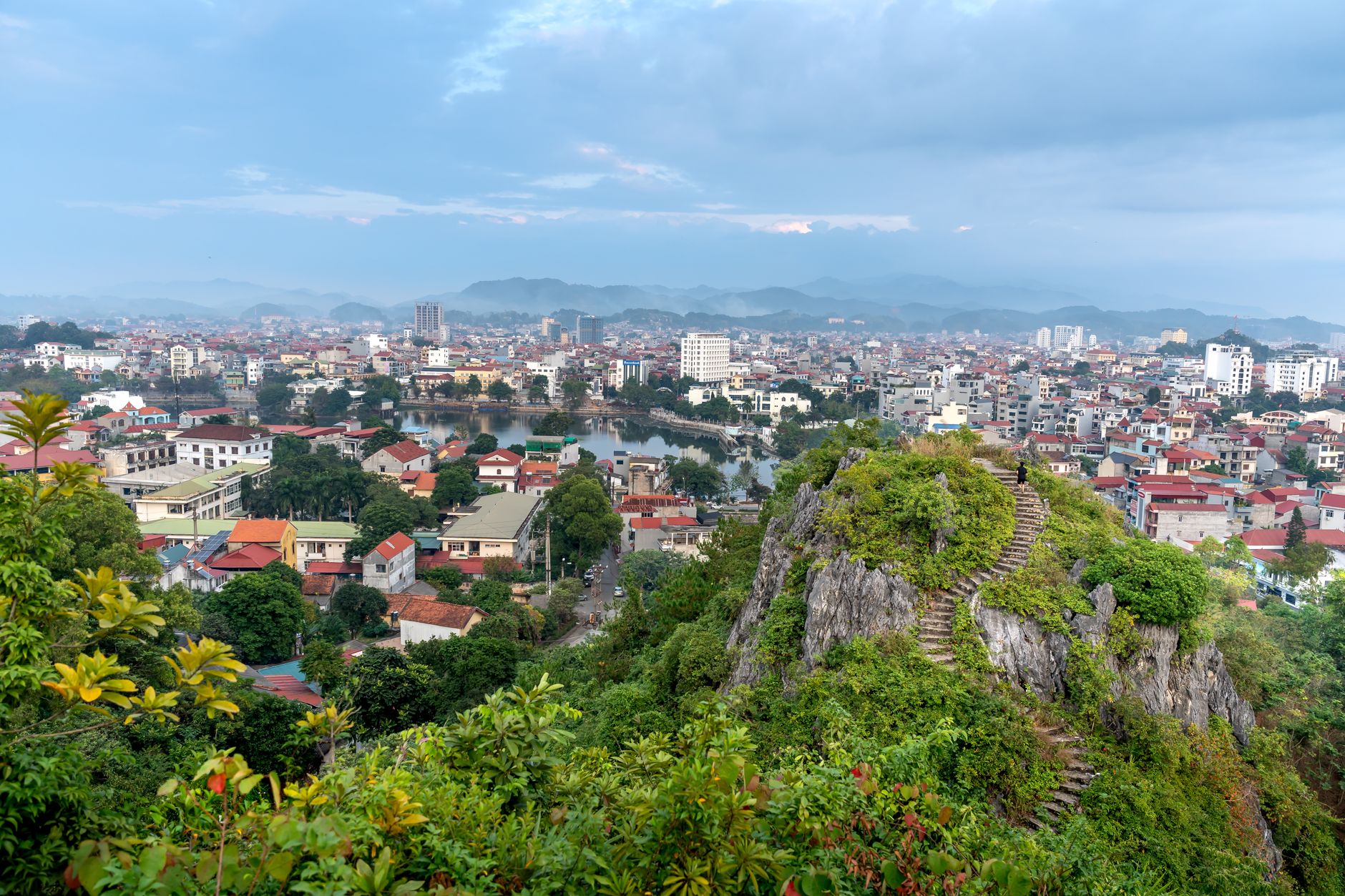 Breathtaking panorama of Lang Son from Tam Thanh mountain, capturing city vibrancy and lush greenery.