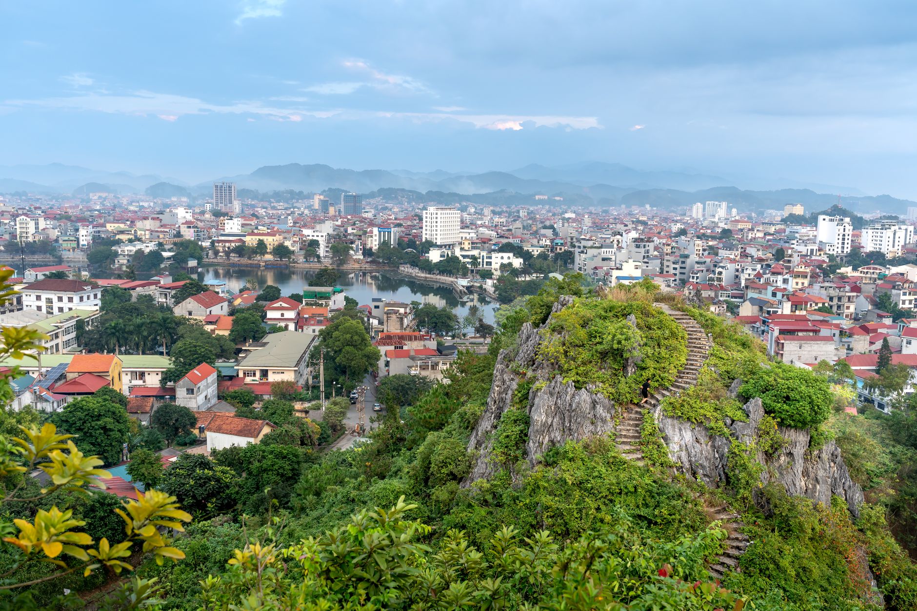 Breathtaking aerial view of Lang Son City with Mac Citadel's rock formations and vibrant urban landscape.