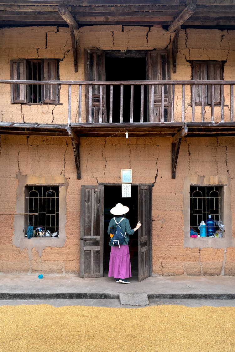 Woman In Building Entrance