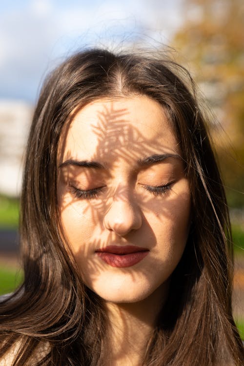 Close Photo of Woman with Eye Closed