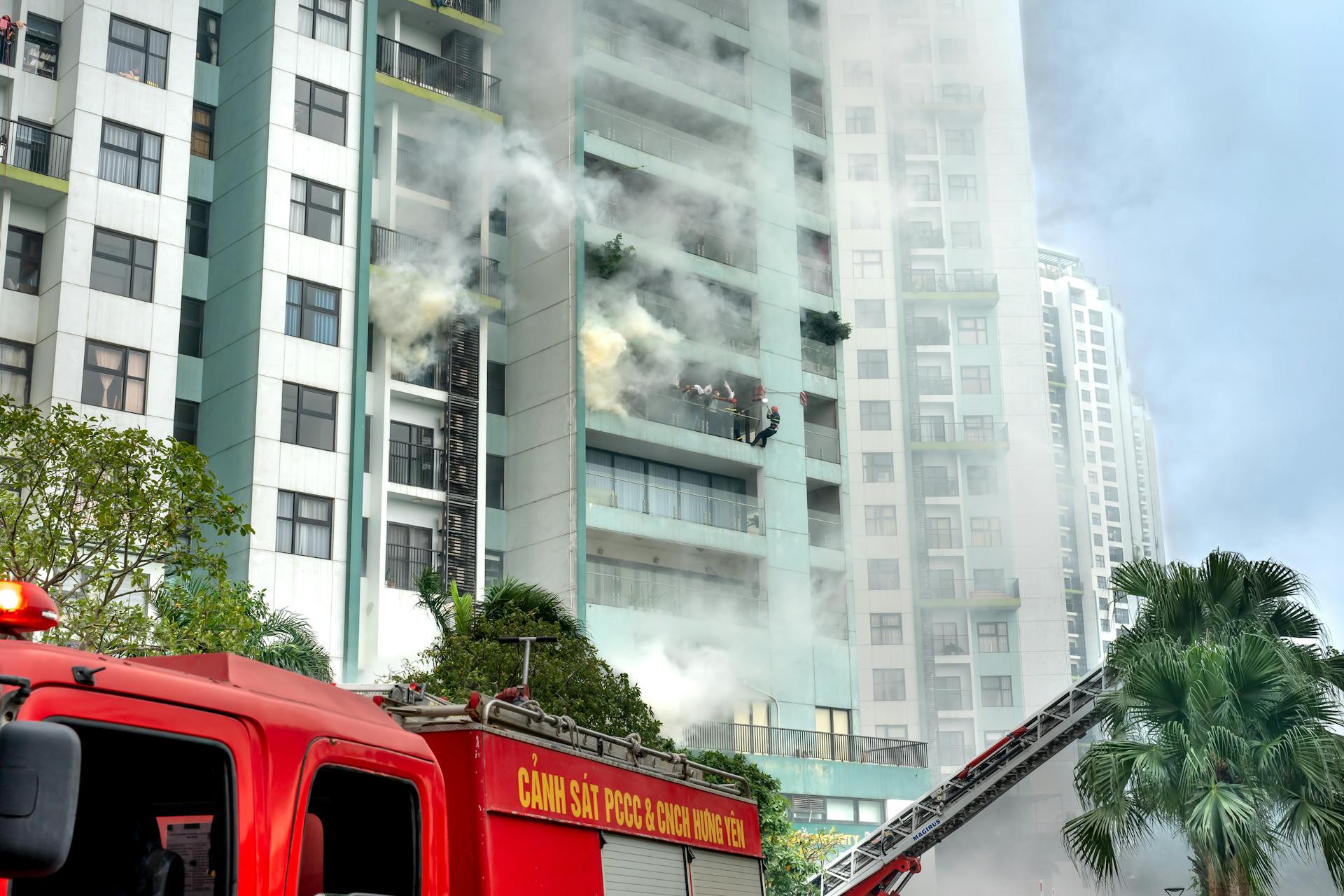 Firefighters Extinguishing a Fire of a Building in City