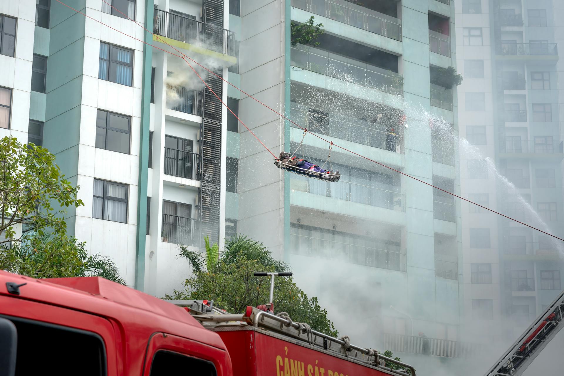 Firefighters Extinguishing a Fire of a Building in City