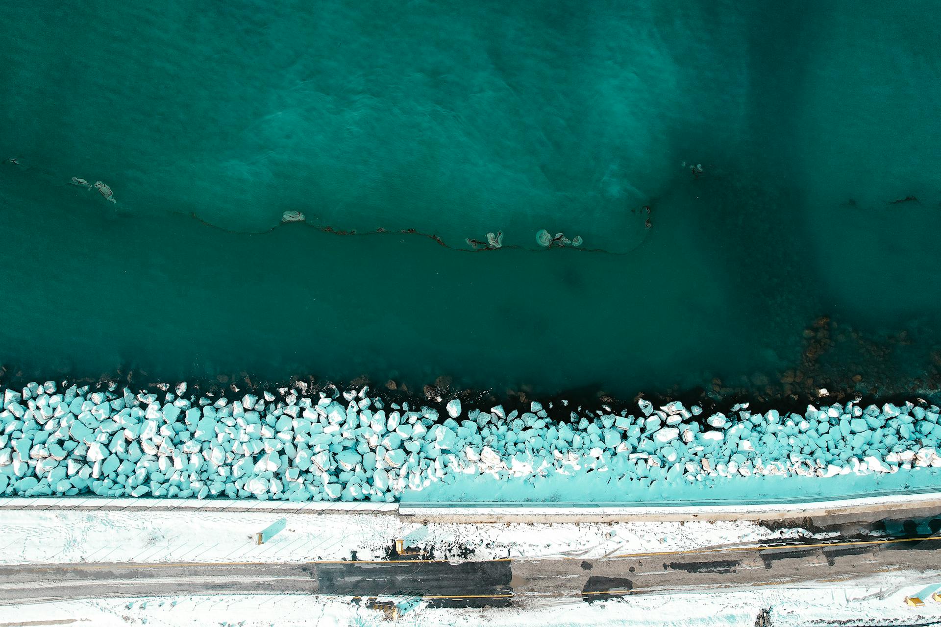 Top View of a Snowy Road and Ice on a Shore